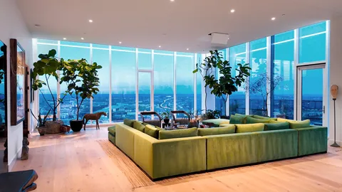 a living room with furniture plant and a potted plant
