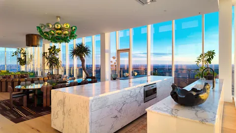 a kitchen with stainless steel appliances kitchen island granite countertop a large counter top stainless steel appliances and cabinets