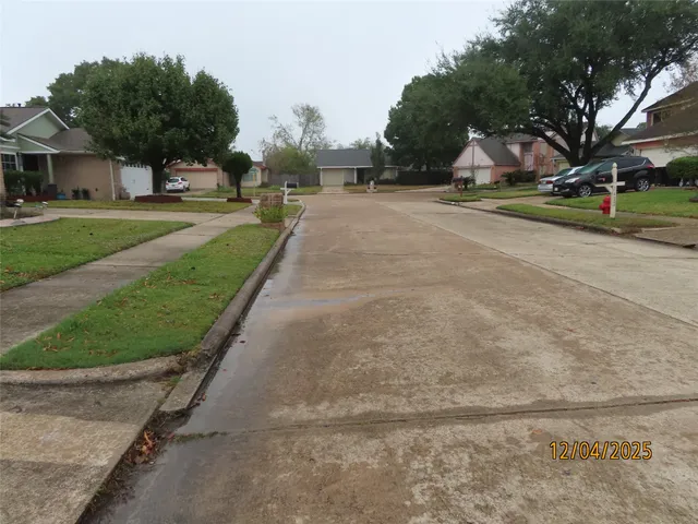 a view of a park with large trees