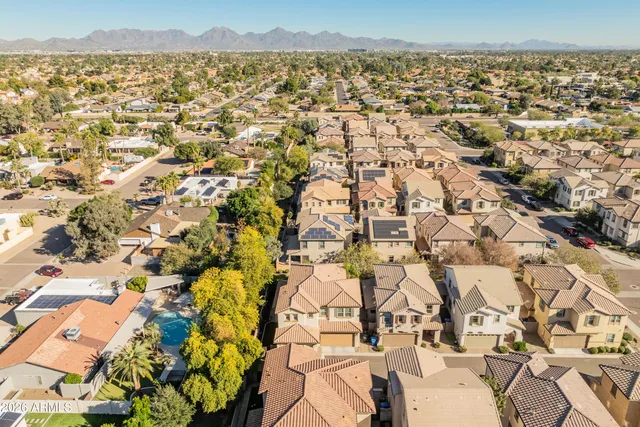 an aerial view of residential houses with outdoor space