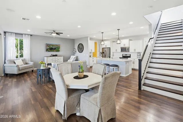 a view of a dining room with furniture and wooden floor