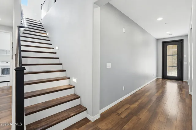 a view of entryway with wooden floor
