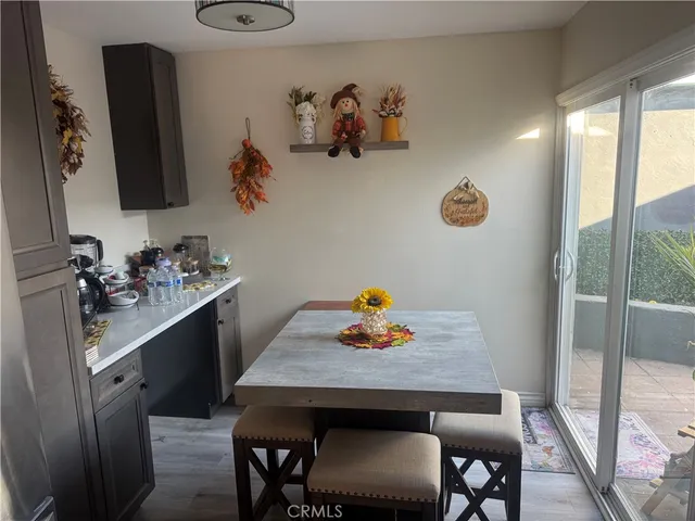 a kitchen with a table and chairs in it