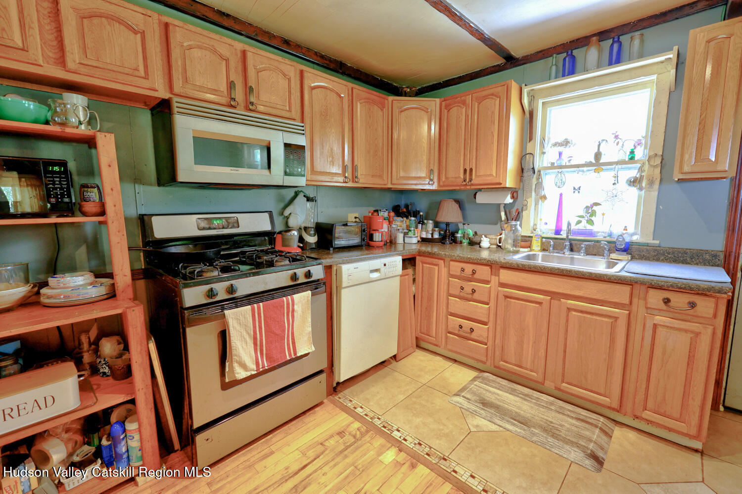 457 Hervey Street Road Cornwallville, NY 12418 - Photo 13 of 61 a kitchen with stainless steel appliances granite countertop a stove a sink and a microwave