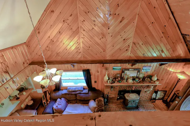 a bedroom with a large bed and dresser