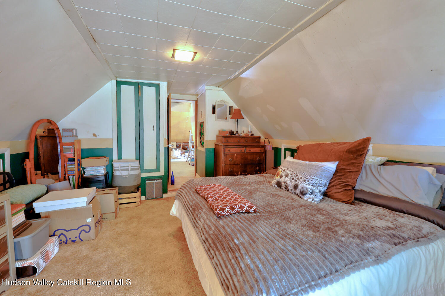 457 Hervey Street Road Cornwallville, NY 12418 - Photo 21 of 61 a bedroom with a large bed and a chandelier