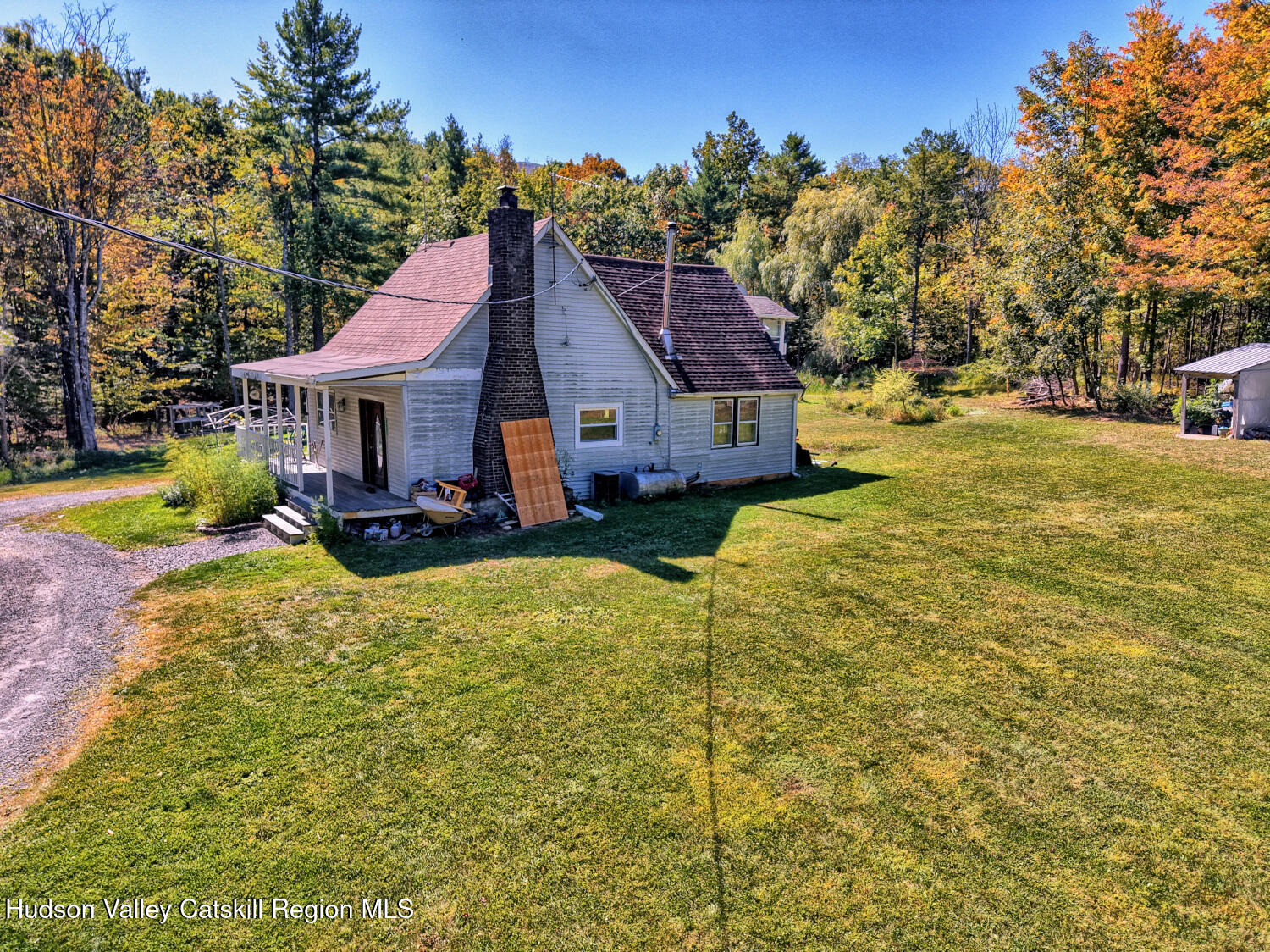 457 Hervey Street Road Cornwallville, NY 12418 - Photo 42 of 61 a view of a house with a large tree and a yard