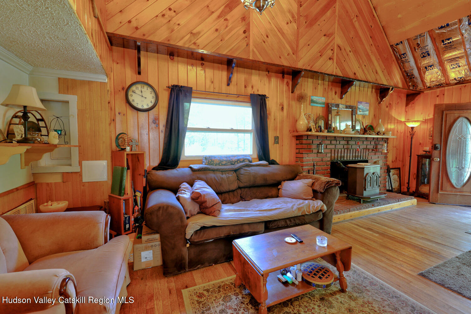 457 Hervey Street Road Cornwallville, NY 12418 - Photo 5 of 61 a living room with furniture a fireplace a rug and a window