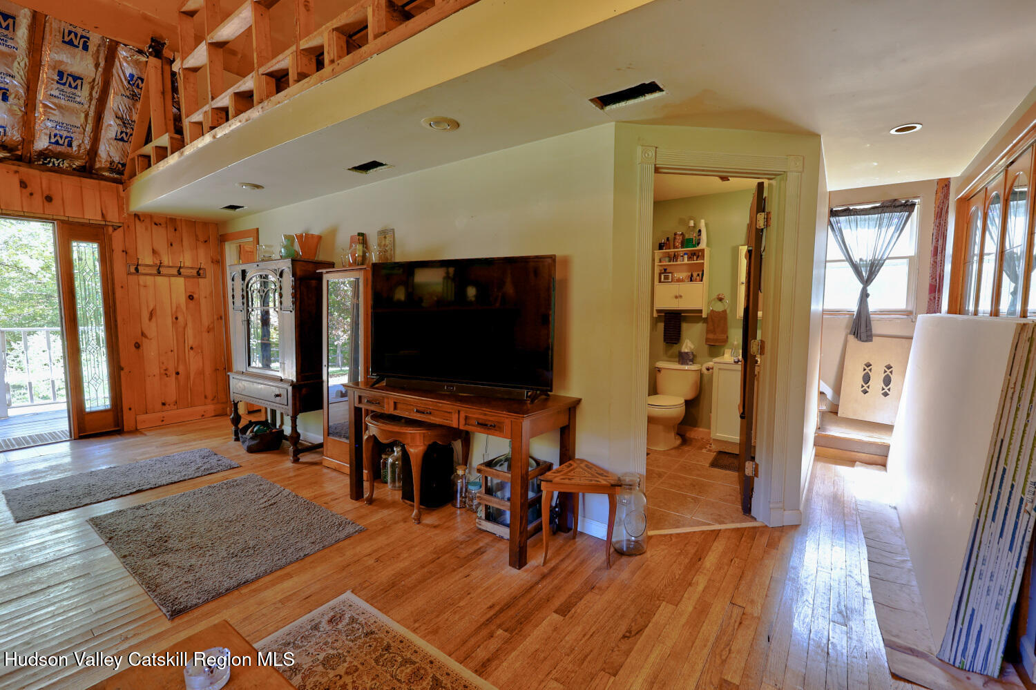 457 Hervey Street Road Cornwallville, NY 12418 - Photo 6 of 61 a living room with furniture and a flat screen tv