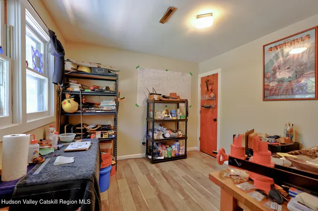 a bedroom with furniture and a window