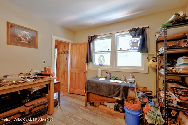 a view of a workspace with furniture and toys