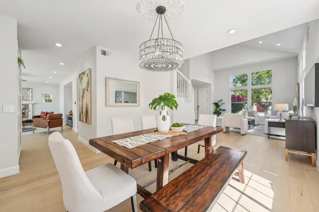 a living room with furniture fireplace and window