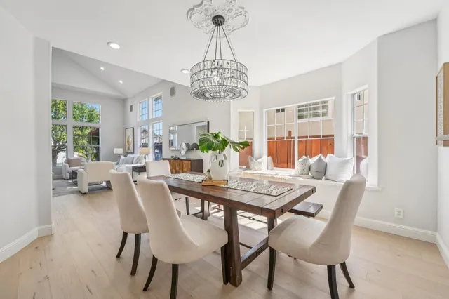 a living room with furniture a rug and a large window