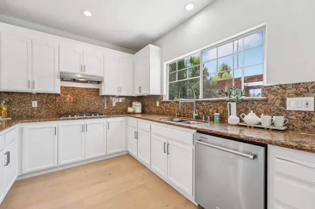 a bedroom with furniture and a chandelier