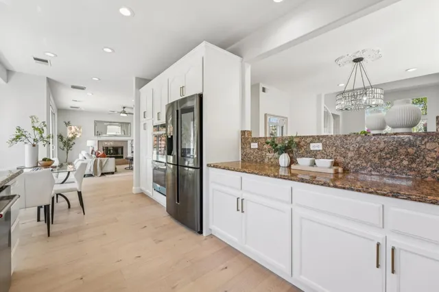 a bathroom with a sink vanity and a mirror