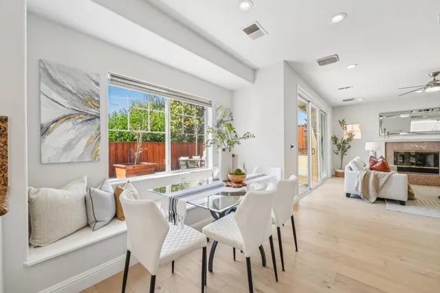 a view of a house with a patio and a yard
