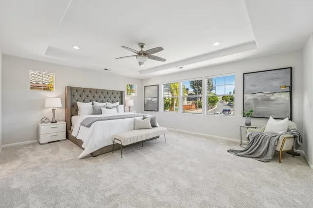 a view of a patio with couches and table and chairs and potted plants