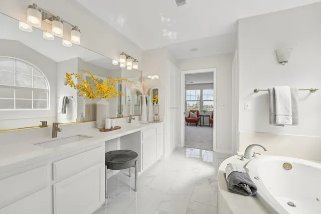 an aerial view of multiple houses with a yard