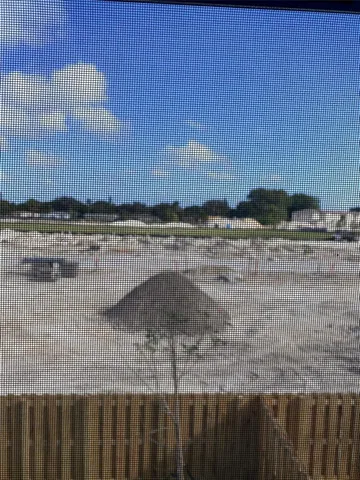 a view of swimming pool with outdoor seating
