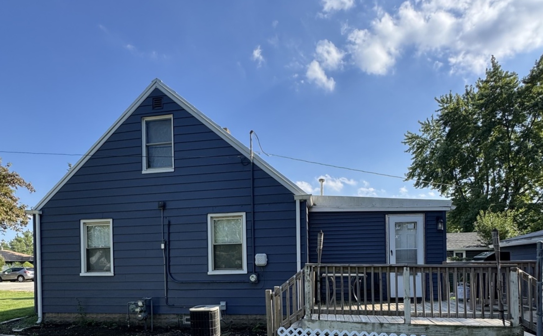 14602 Kenton Avenue Midlothian, IL 60445 - Photo 2 of 10 a view of a house with wooden fence and large trees