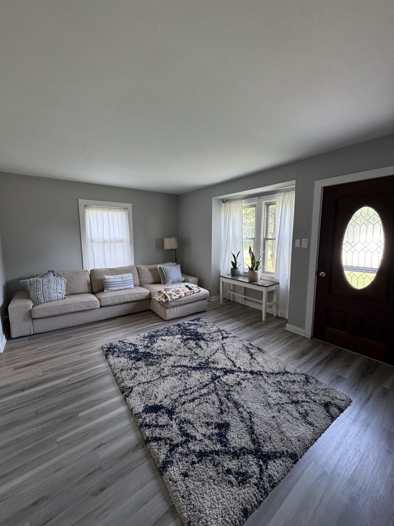 14602 Kenton Avenue Midlothian, IL 60445 - Photo 3 of 10 a living room with furniture and a large window