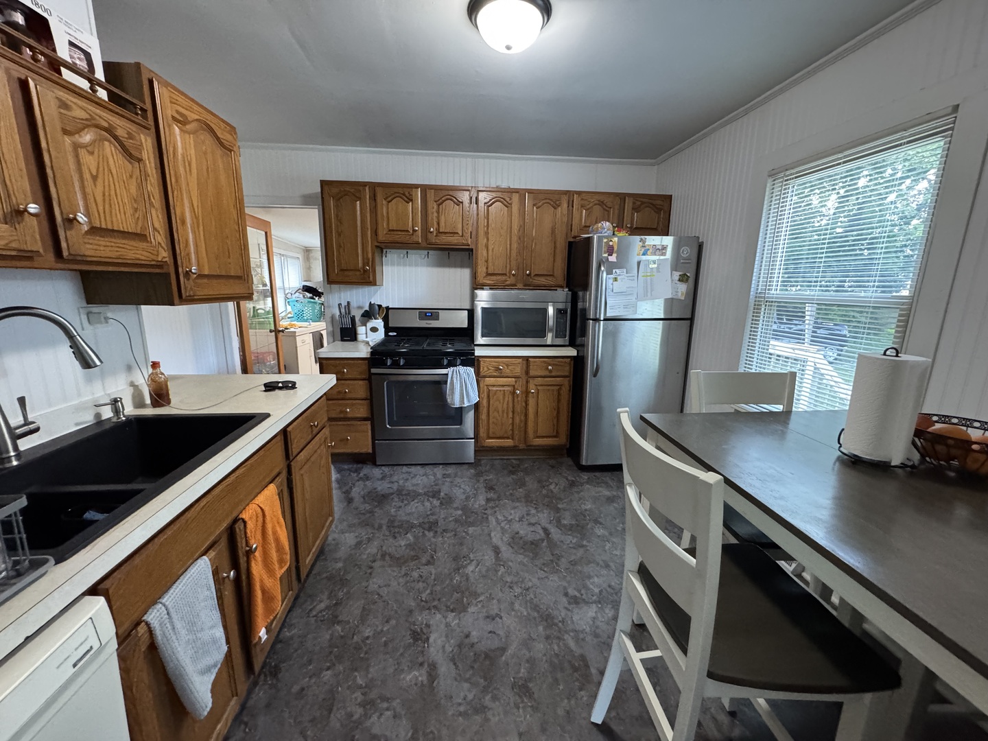 14602 Kenton Avenue Midlothian, IL 60445 - Photo 5 of 10 a kitchen with refrigerator cabinets and a sink