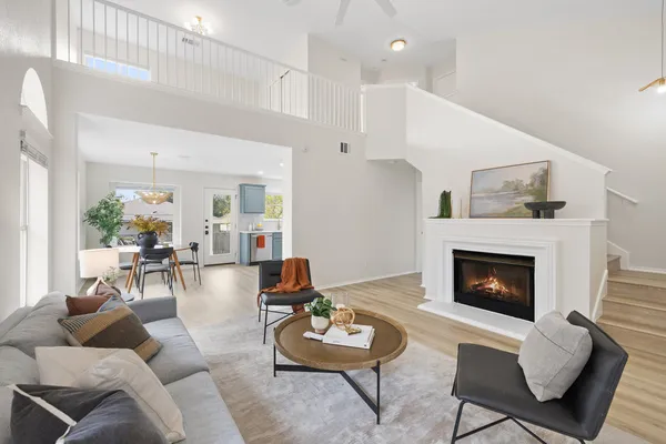 a living room with furniture and a fireplace