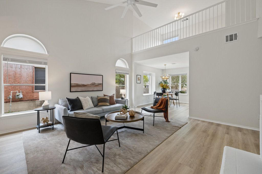 1305 Tudor House Road Pflugerville, TX 78660 - Photo 13 of 40 Luxury vinyl plank flooring runs throughout the home, offering durability with a refined, modern look.