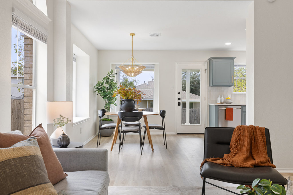 1305 Tudor House Road Pflugerville, TX 78660 - Photo 15 of 40 The dining space is bright and inviting, positioned perfectly for everyday meals and special gatherings alike.