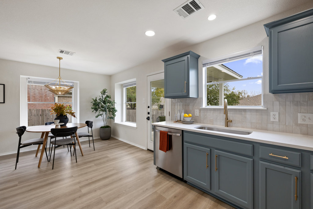 1305 Tudor House Road Pflugerville, TX 78660 - Photo 16 of 40 An open connection between the dining area and kitchen creates a welcoming hub for hosting, cooking, and conversation.