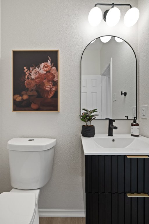 1305 Tudor House Road Pflugerville, TX 78660 - Photo 20 of 40 A stylish powder bath features modern finishes and designer details that elevate even the smallest spaces.