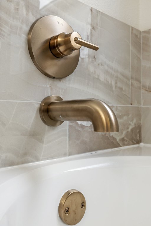 1305 Tudor House Road Pflugerville, TX 78660 - Photo 28 of 40 Every detail in the primary bathroom was thoughtfully chosen to create a space that feels luxurious, calming, and refined.