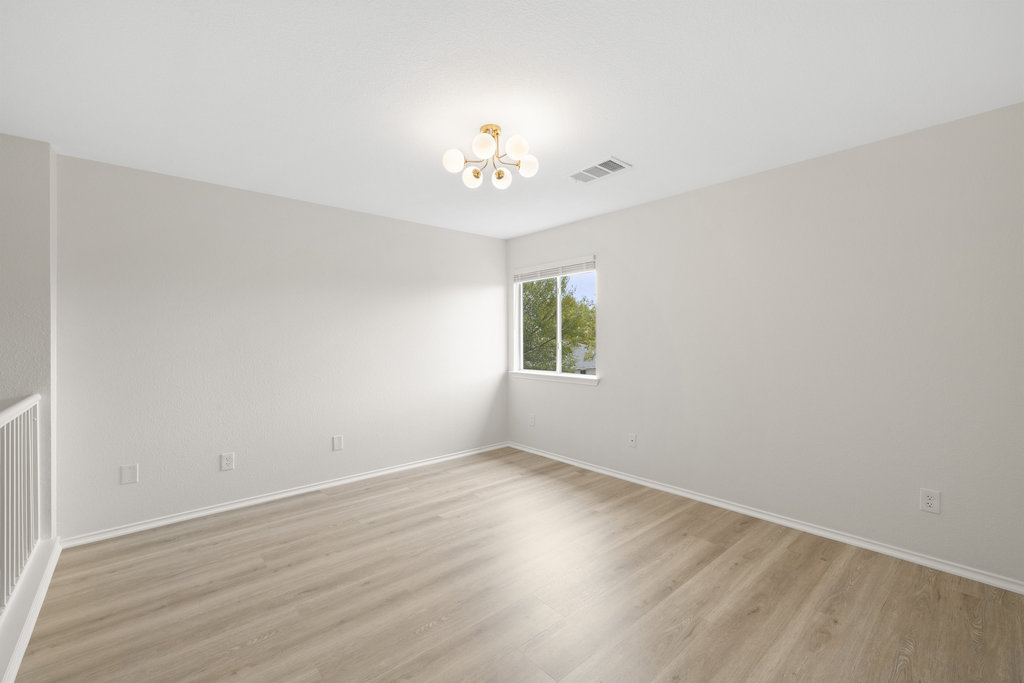 1305 Tudor House Road Pflugerville, TX 78660 - Photo 31 of 40 This upstairs room offers a bright, open canvas, perfect for a media lounge, home office, or creative retreat.