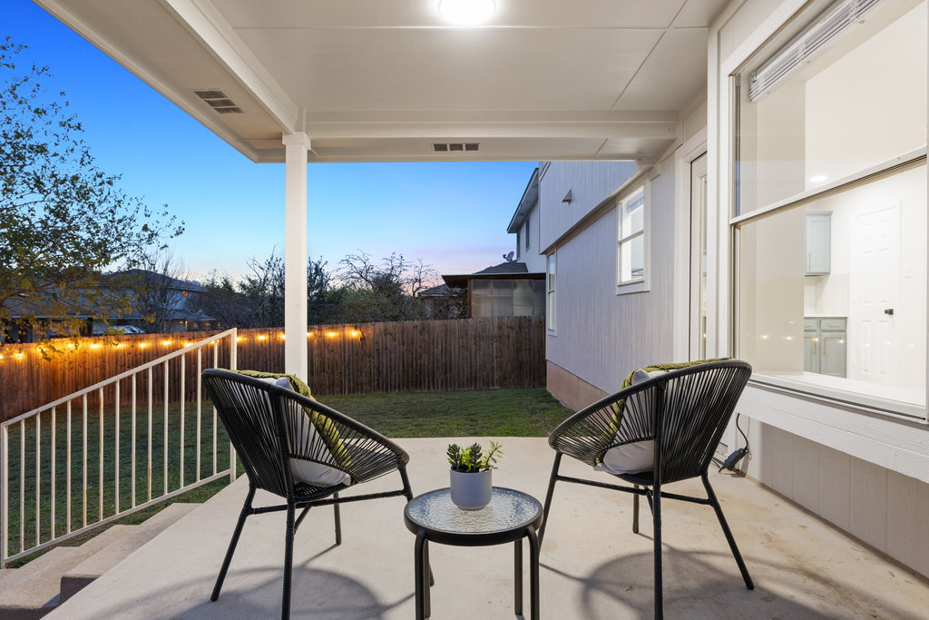 1305 Tudor House Road Pflugerville, TX 78660 - Photo 36 of 40 The covered back patio creates a private outdoor retreat, ideal for morning coffee or evening unwinding.