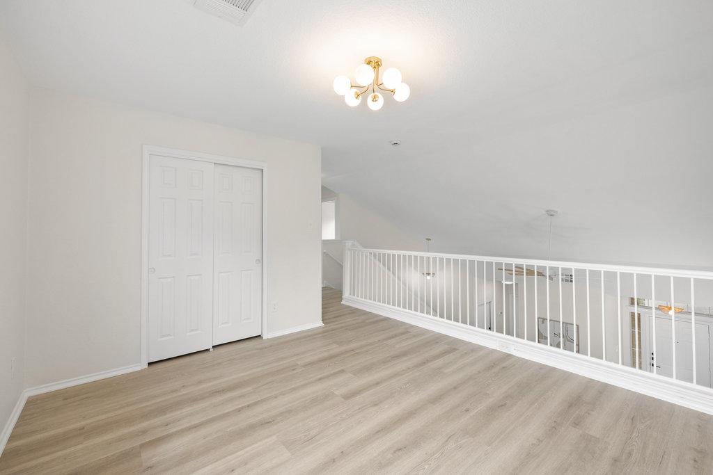 1305 Tudor House Road Pflugerville, TX 78660 - Photo 6 of 40 This loft space easily adapts to an art studio, reading lounge, play area, or additional bedroom with a closet already in place.