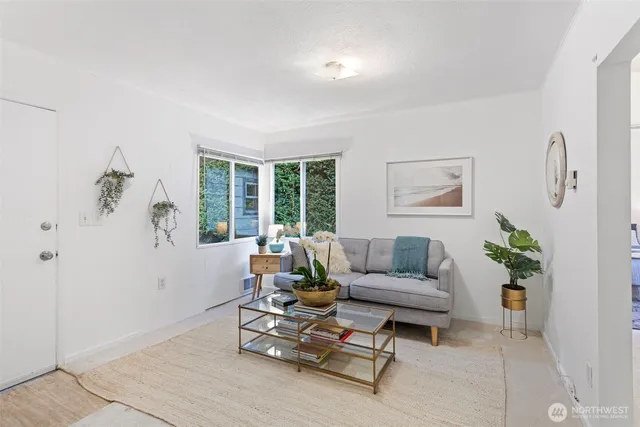 a bedroom with a bed a table and chair