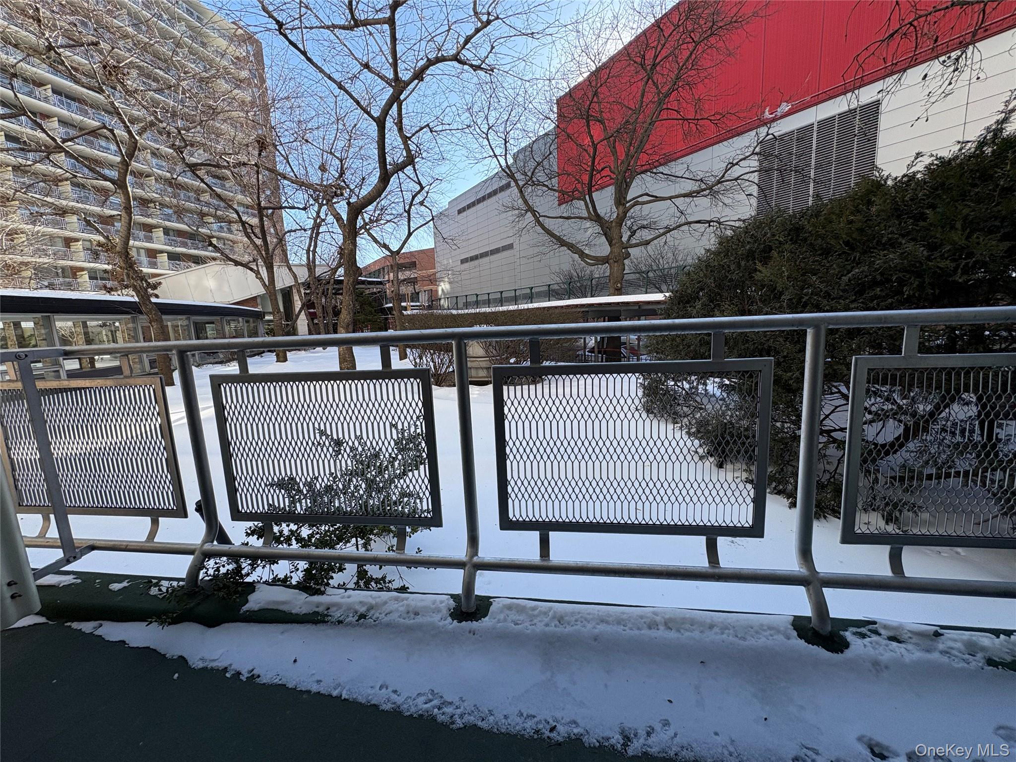 61-15 97th Street, Unit LC Queens, NY 11374 - Photo 15 of 27 a view of a patio with a table and chairs