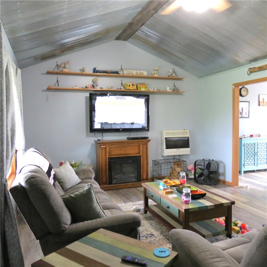 21242 Dingman-Slagle Road Pemberton, OH 45353 - Photo 6 of 33 This inviting living space features vaulted ceilings and a charming fireplace.