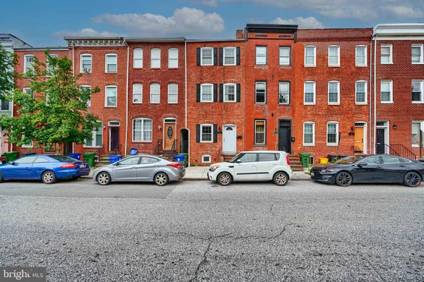 a view of cars parked in front of a building