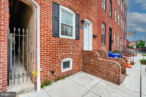 a view of brick buildings with many windows