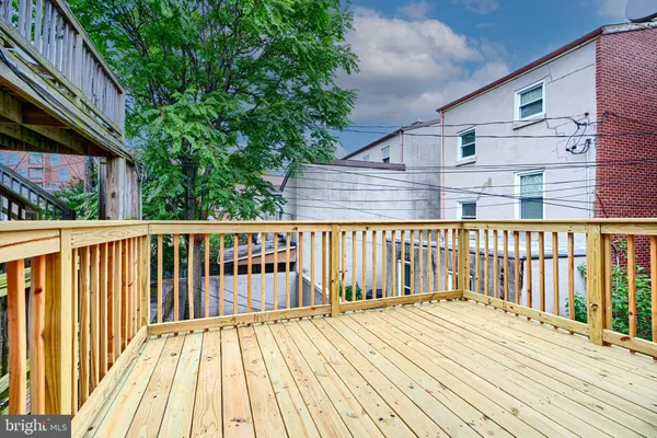 a balcony with wooden floor