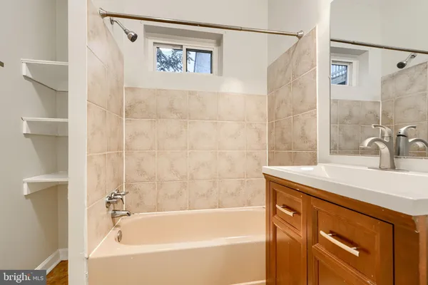 a bathroom with a sink and a bathtub