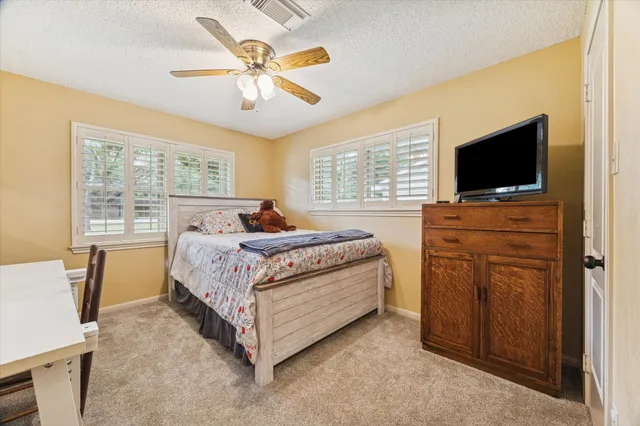 a kitchen with a sink cabinets and wooden floor