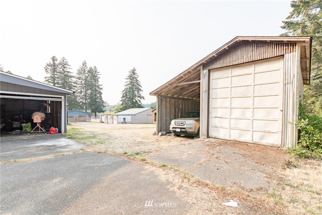 3826 Sapp Road Southwest Olympia, WA 98512 - Photo 2 of 39 a view of a house with a big yard and large trees