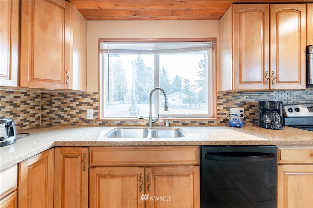 3826 Sapp Road Southwest Olympia, WA 98512 - Photo 13 of 39 a kitchen with a sink and a window