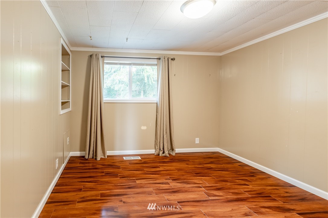 3826 Sapp Road Southwest Olympia, WA 98512 - Photo 17 of 39 a view of a room with wooden floor and white walls