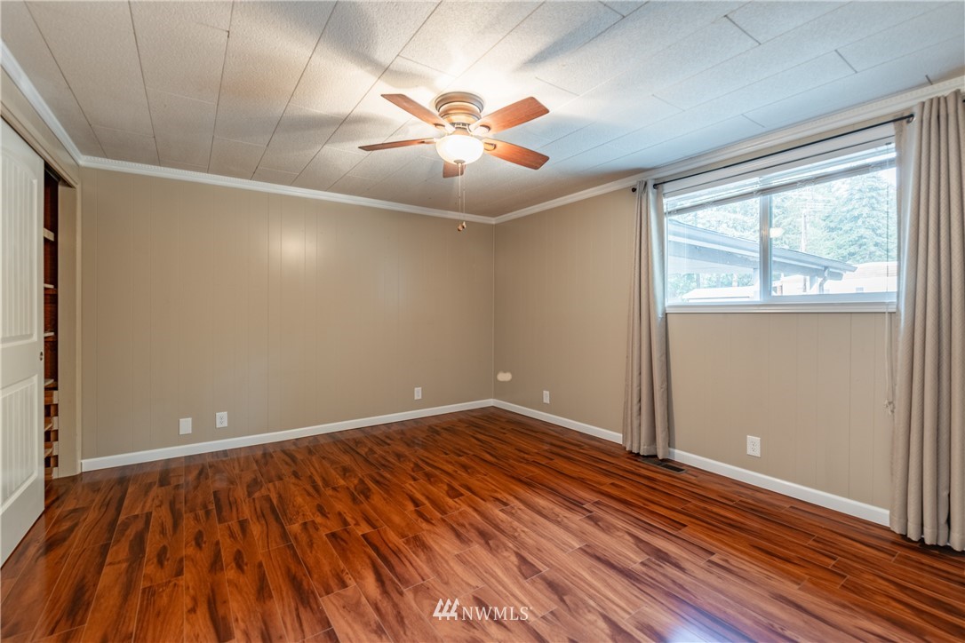 3826 Sapp Road Southwest Olympia, WA 98512 - Photo 18 of 39 an empty room with wooden floor and windows