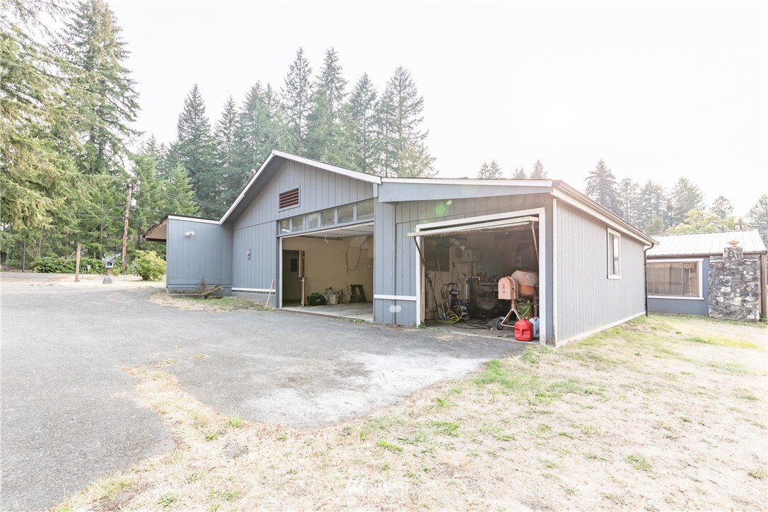 3826 Sapp Road Southwest Olympia, WA 98512 - Photo 3 of 39 a view of a house with a yard and garage