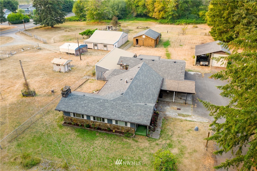 3826 Sapp Road Southwest Olympia, WA 98512 - Photo 39 of 39 an aerial view of a house with swimming pool and large trees