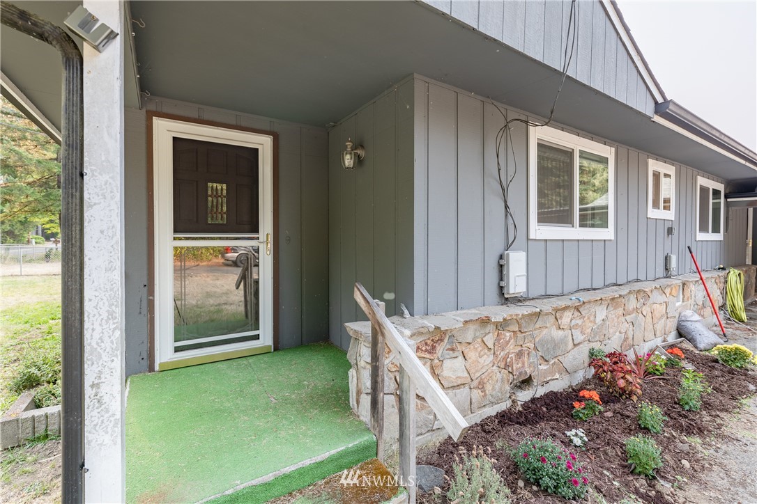 3826 Sapp Road Southwest Olympia, WA 98512 - Photo 6 of 39 a view of a porch with a table and chairs